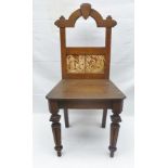 A LATE 19TH CENTURY GOTHIC REVIVAL HALL CHAIR stained and grained effect frame, the back inlaid