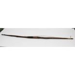 A 19TH CENTURY YEW WOOD LONG BOW, with leather grip, 162cm