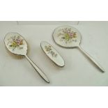 ADIE BROTHERS OF BIRMINGHAM A THREE PIECE DRESSING TABLE SET, white metal and decorative enamel,