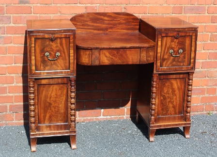 A 19TH CENTURY MAHOGANY TWIN PEDESTAL SIDEBOARD, having gallery back, the breakfront centre with