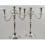A PAIR OF 20TH CENTURY SILVER PLATED THREE SCONCE TABLE CANDELABRAS with decorative beadwork banding
