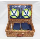 AN "OPTIMA" PICNIC BASKET containing four place settings and picnic accessories