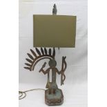 A FIGURAL FRET CUT PATINATED STEEL TABLE LAMP by repute Pozzi Franzetti, the figure standing on a