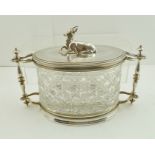 A LATE VICTORIAN BISCUIT CANISTER having silver plated mounts on an oval cut glass body