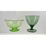 TWO EARLY 20TH CENTURY GREEN GLASS PEDESTAL BOWLS one believed 'Powell'