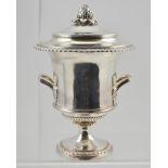 S.W. SMITH AND CO. A GEORGE V SILVER TABLE CENTRE PIECE in the form of a two-handled wine cooler