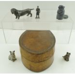 A CAST METAL MODEL OF A DACHSHUND, two cast models of Scottie Dogs, an Inuit model beaver, a cast