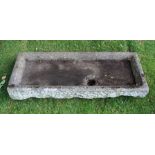 A HAND HEWN BELIEVED LIMESTONE RECTANGULAR SHALLOW SINK/TROUGH with drainage hole 16cm high, 121cm