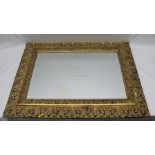 A LARGE GILT FRAMED RECTANGULAR BEVELLED PLATE WALL MIRROR