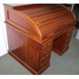 A LATE 19TH CENTURY MAHOGANY TAMBOUR TOP WRITING DESK, having fitted interior with pigeon holes