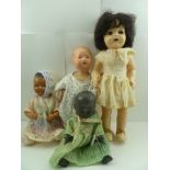 A "ROSEBUD" BLACK CELLULOID BABY DOLL, 34cm high, together with a Pedigree 1950's doll and two