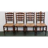 A SET OF FOUR LADDER BACK DINING CHAIRS, rush seated