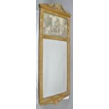 A FRENCH EMPIRE DESIGN GILT FRAMED PIER MIRROR, with ribbon swag crest upper portion inlaid with a