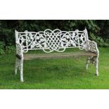 A CAST METAL FRAMED COALBROOKDALE STYLE THREE PERSON GARDEN BENCH with slatted seat,