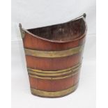 A 19TH CENTURY DUTCH MAHOGANY BUCKET of elliptical form, brass banded with brass wire handle, 36cm