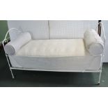 A FRENCH WROUGHT METAL FRAMED DAY BED, white painted with squab seat and a pair of roll cushions,