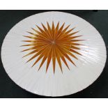 A 1970's TILE TOP COFFEE TABLE, having central sunburst design, on metal supports, 116cm diameter