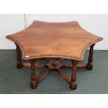 A MAHOGANY 'STAR' TOP COFFEE TABLE, stamped "Simpsons of Norfolk" raised on six ring