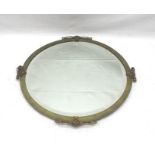 AN EDWARDIAN CIRCULAR BRASS FRAMED WALL MIRROR with decorative devices to the edge, bevel plate size