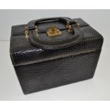 AN "L.A.P.A." FLORENCE BLACK LEATHER VANITY CASE OF GLADSTONE BAG DESIGN, with two handles to the