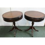 A PAIR OF REPRODUCTION MAHOGANY WINE TABLES of drum form with drawers on stems and four outswept