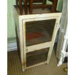 A PAINTED METAL CABINET with twin mesh grill panelled single door