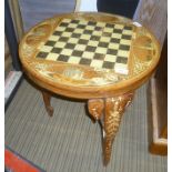 AN INDIAN INLAID CHESS BOARD TOPPED CIRCULAR TABLE with four vignettes, supported on three