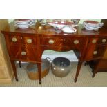 A GEORGIAN DESIGN REPRODUCTION BOW FRONT SIDEBOARD by William Tillman, having cross banded top