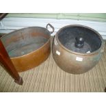 A TWIN HANDLED OVAL COPPER PLANTER together with a copper cauldron, a glass pendant light shade