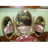 A GILT FRAMED TRIPLE PLATE DRESSING TABLE TOP MIRROR