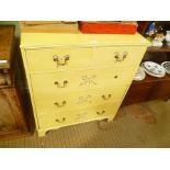 A YELLOW PAINTED CHEST OF DRAWERS with decorative stencilling