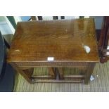 A MID 20TH CENTURY OAK NEST OF THREE TABLES one rectangular topped with two square topped orphans