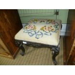 A 19TH CENTURY SQUARE PAD TOPPED STOOL on ebonised frame