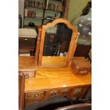 A MIXED WOOD DRESSING TABLE UNIT, having fancy shaped adjustable bevelled mirrored back, on twin