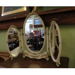 AN OVAL TRIPLE PLATE ADJUSTABLE DRESSING TABLE TOP MIRROR