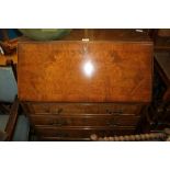 A MID 20TH CENTURY REPRODUCTION WALNUT COLOURED BUREAU, of typical form and construction, with three