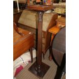 A MAHOGANY FINISHED SQUARE TOPPED PLANT STAND on reeded column