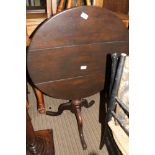 A 19TH CENTURY OAK TILT TOP TABLE on turned column and three downswept legs