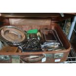 A SMALL TAN SUITCASE CONTAINING DOMESTIC METALWARES the majority silver plate for the table top,