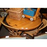 A 20TH CENTURY CIRCULAR TOPPED KITCHEN TABLE on central column, together with FOUR BEECHWOOD SOLID