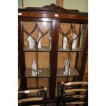 A 20TH CENTURY MAHOGANY FINISHED GLAZED DISPLAY CABINET, with upholstered shelved interior