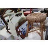 A SHIELD SHAPED MIRROR, A PAINTED MAGAZINE RACK, a woven stool and twin tiled mahogany tray