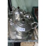 A PLANISHED PEWTER FIVE PIECE TEA SERVICE