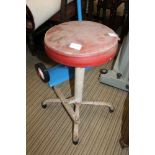 A METAL BASED PAD TOPPED INDUSTRIAL MACHINIST STOOL