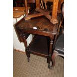 AN OAK FINISHED TWIN FLAP TOPPED SERVING TROLLEY