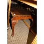 A REPRODUCTION MAHOGANY COLOURED RECTANGULAR COFFEE TABLE with carved frieze and cabriole legs