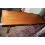 A MAHOGANY COLOURED LOW RECTANGULAR TOP SPANISH DESIGN COFFEE TABLE