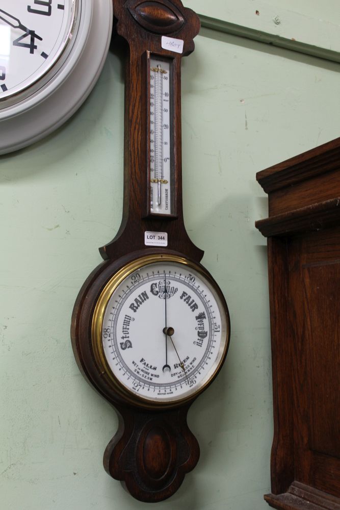 AN OAK BACKED BANJO BAROMETER THERMOMETER