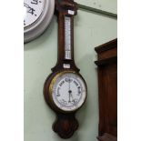 AN OAK BACKED BANJO BAROMETER THERMOMETER