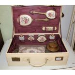 AN IVORY COLOURED VANITY SUITCASE with well-appointed internal fitments